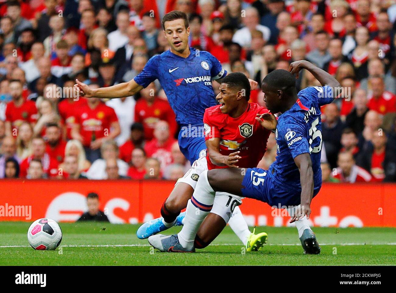 Soccer Football - Premier League - Manchester United v Chelsea - Old Trafford, Manchester, Britain - August 11, 2019  Manchester United are awarded a penalty after Marcus Rashford is fouled by Chelsea's Kurt Zouma   REUTERS/Phil Noble  EDITORIAL USE ONLY. No use with unauthorized audio, video, data, fixture lists, club/league logos or 'live' services. Online in-match use limited to 75 images, no video emulation. No use in betting, games or single club/league/player publications.  Please contact your account representative for further details. Stock Photo