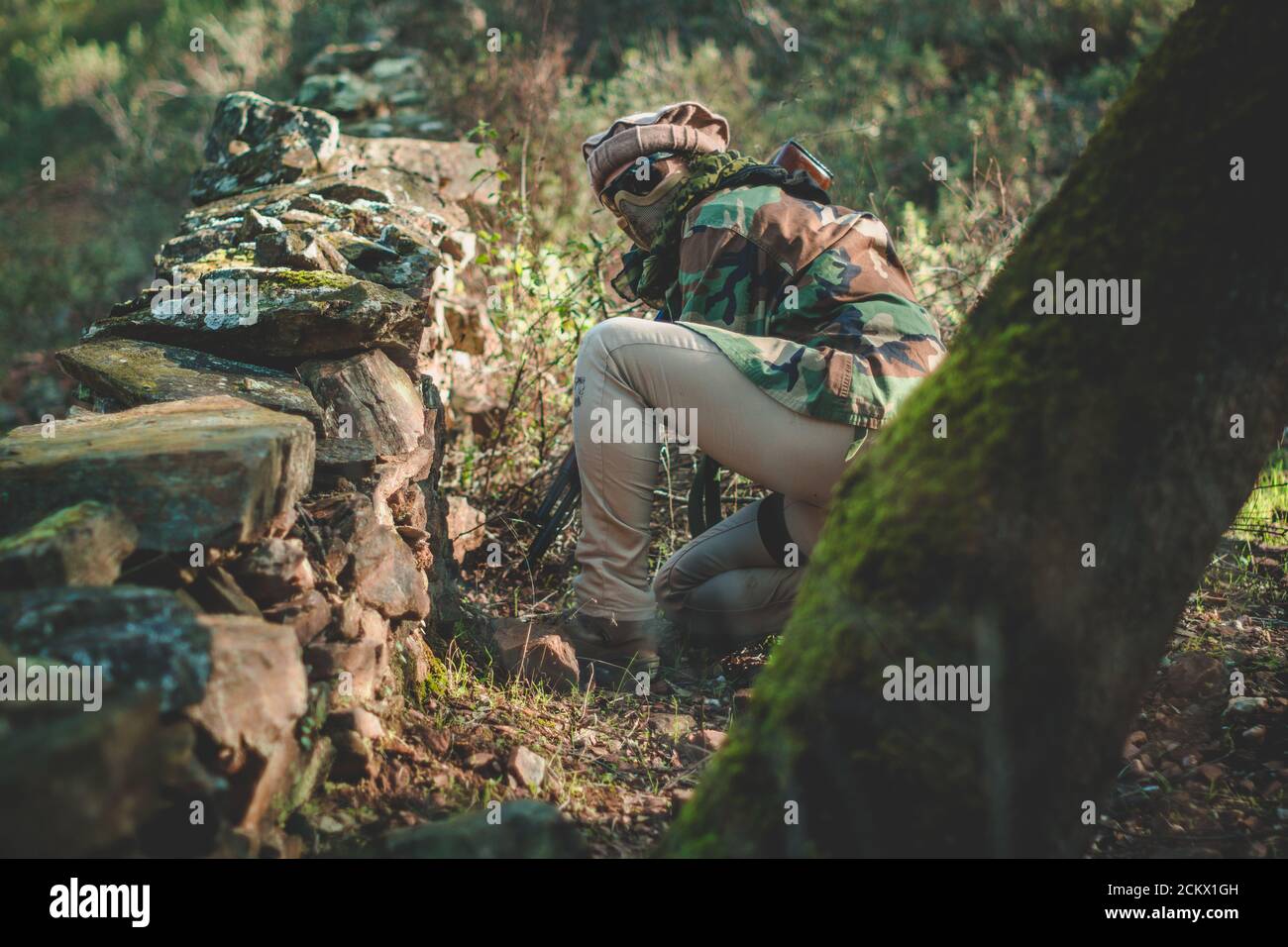 Closeup shot of military actions in the forest Stock Photo - Alamy