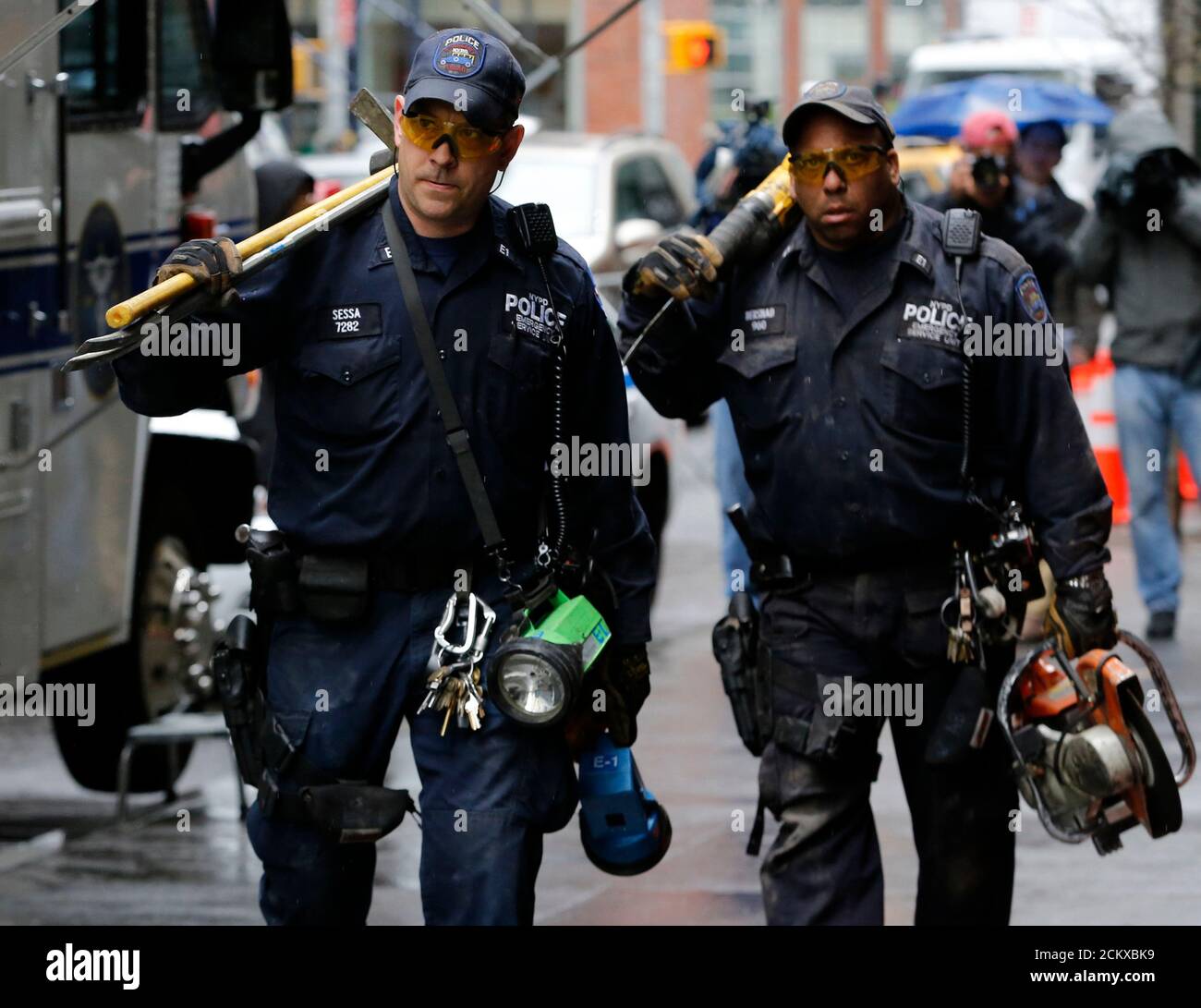 Members of the New York Police Department Emergency Service Unit exit 51 Park Place in New York, April 29, 2013. A Boeing representative confirmed to the New York Police Department that wreckage discovered last week, in a narrow alleyway behind 51 Park Place and 50 Murray Street in Manhattan's financial district, 'is believed to be from one of the two aircraft destroyed on September 11, 2001, but it could not be determined which one,' Paul Browne, NYPD's chief spokesman, said on Monday.  REUTERS/Brendan McDermid (UNITED STATES  - Tags: TRANSPORT DISASTER CRIME LAW) Stock Photo