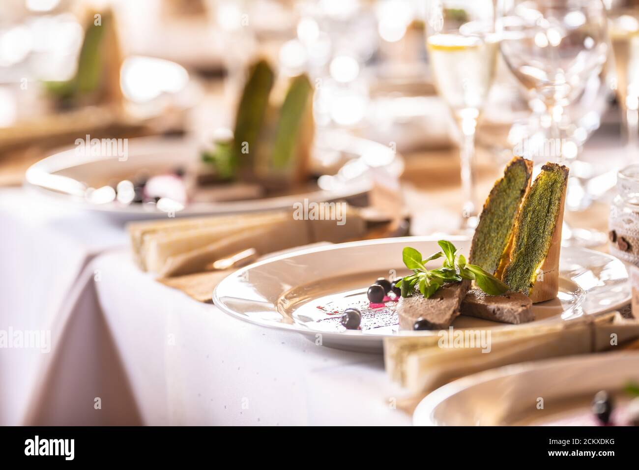 Festive tableware with a foie gras appetizer prepared for the dinner