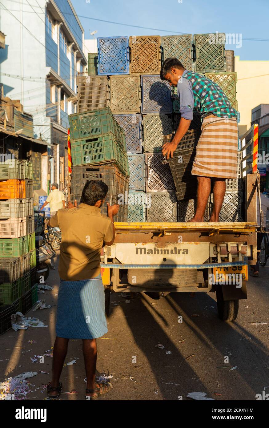 Loading of vegetable plastic cartons in tempo near local market in Madurai, Tamil Nadu, India Stock Photo