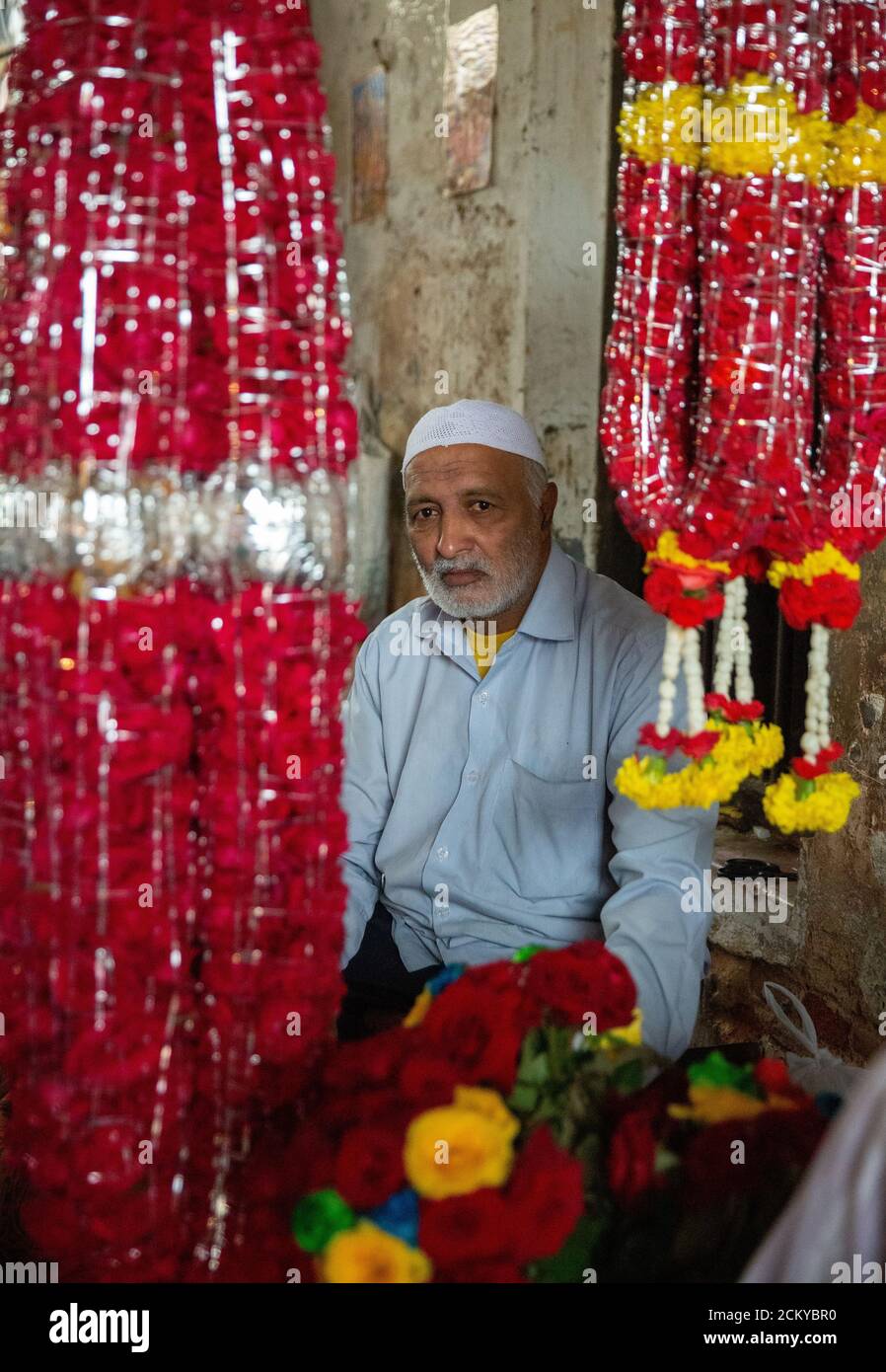 A local flower seller in a local flower market in Mysore, Karnataka, India Stock Photo