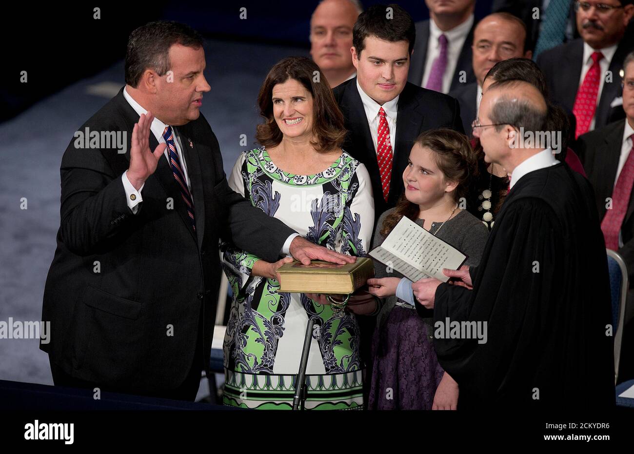 Governor Chris Christie holds his hand aloft as he is sworn in for his second term at the War Memorial Theatre in Trenton, New Jersey January 21, 2014. Christie, a Republican Party star enmeshed in scandal after re-election in November, will return to the themes of small government and bipartisan cooperation when he is sworn in for a second term on Tuesday.      REUTERS/Carlo Allegri (UNITED STATES - Tags: POLITICS TPX IMAGES OF THE DAY) Stock Photo
