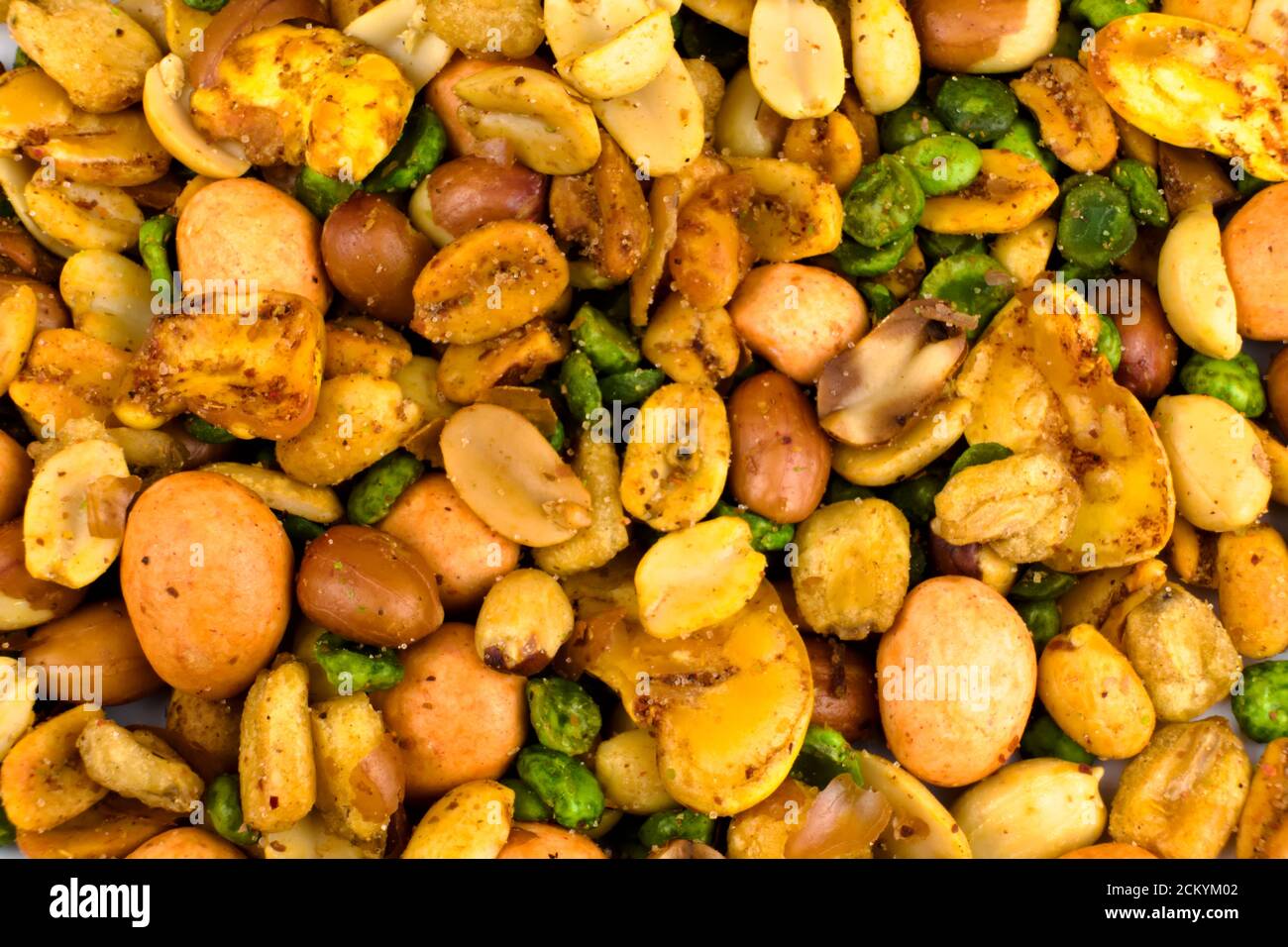 Close-up a Mexican mixed snack food composed of peanuts, Peas, Cracker nuts, broad beans, salted and seasoned with chili peppers powder Stock Photo