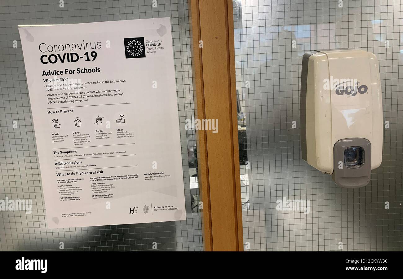 A coronavirus advice notice is seen next to an anti-bacterial gel dispenser in a college in Dublin, Ireland, March 4, 2020. REUTERS/Phil Noble Stock Photo