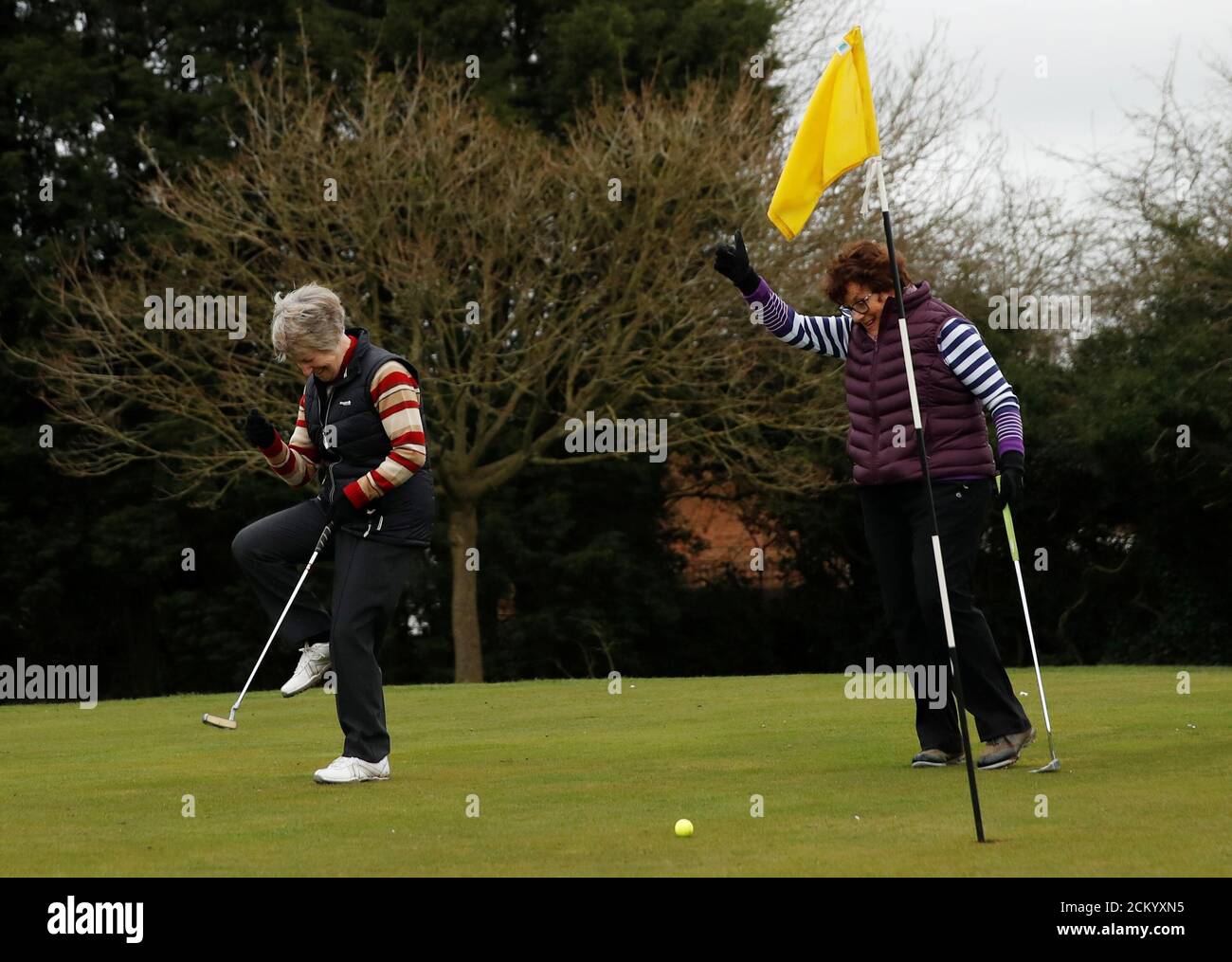 Sheila Carter and Linda Buckingham react on a green at Windmill Hill Golf  Centre in Milton Keynes as the spread of the coronavirus disease (COVID-19)  continues, in Milton Keynes, Britain, March 18,