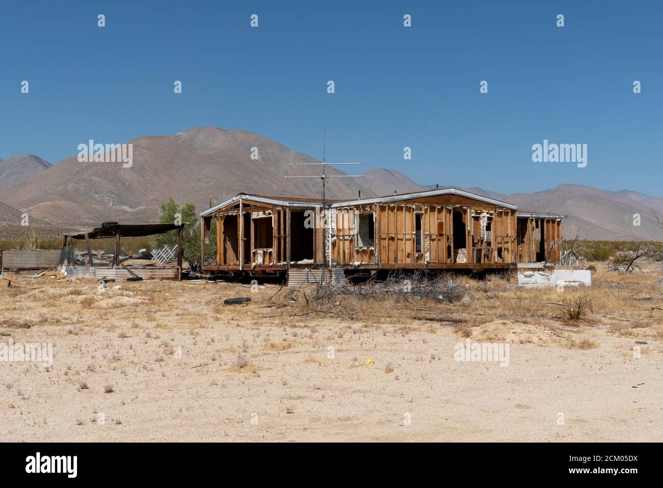 Abandoned house camper trailer in the middle of the desert in