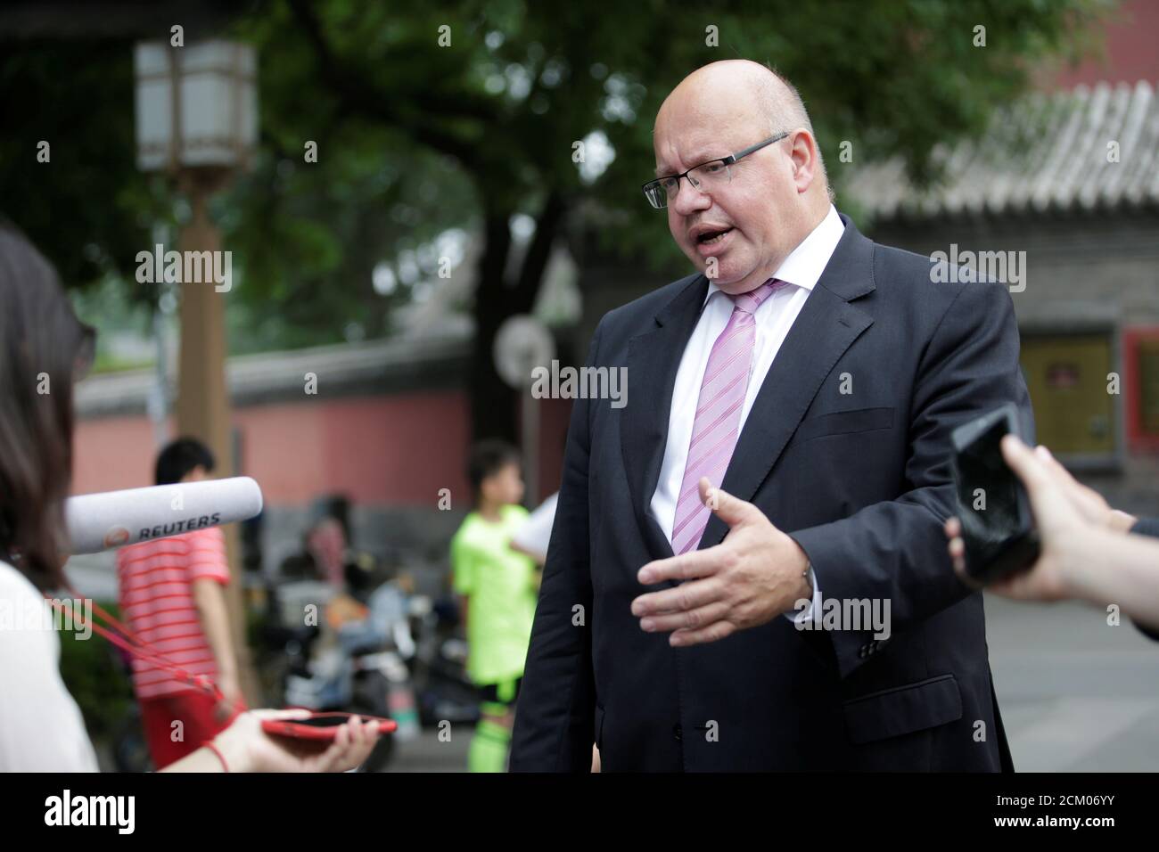 Germany's Economy Minister Peter Altmaier speaks to the media in front of the Drum Tower in Beijing, China June 19, 2019. REUTERS/Jason Lee Stock Photo
