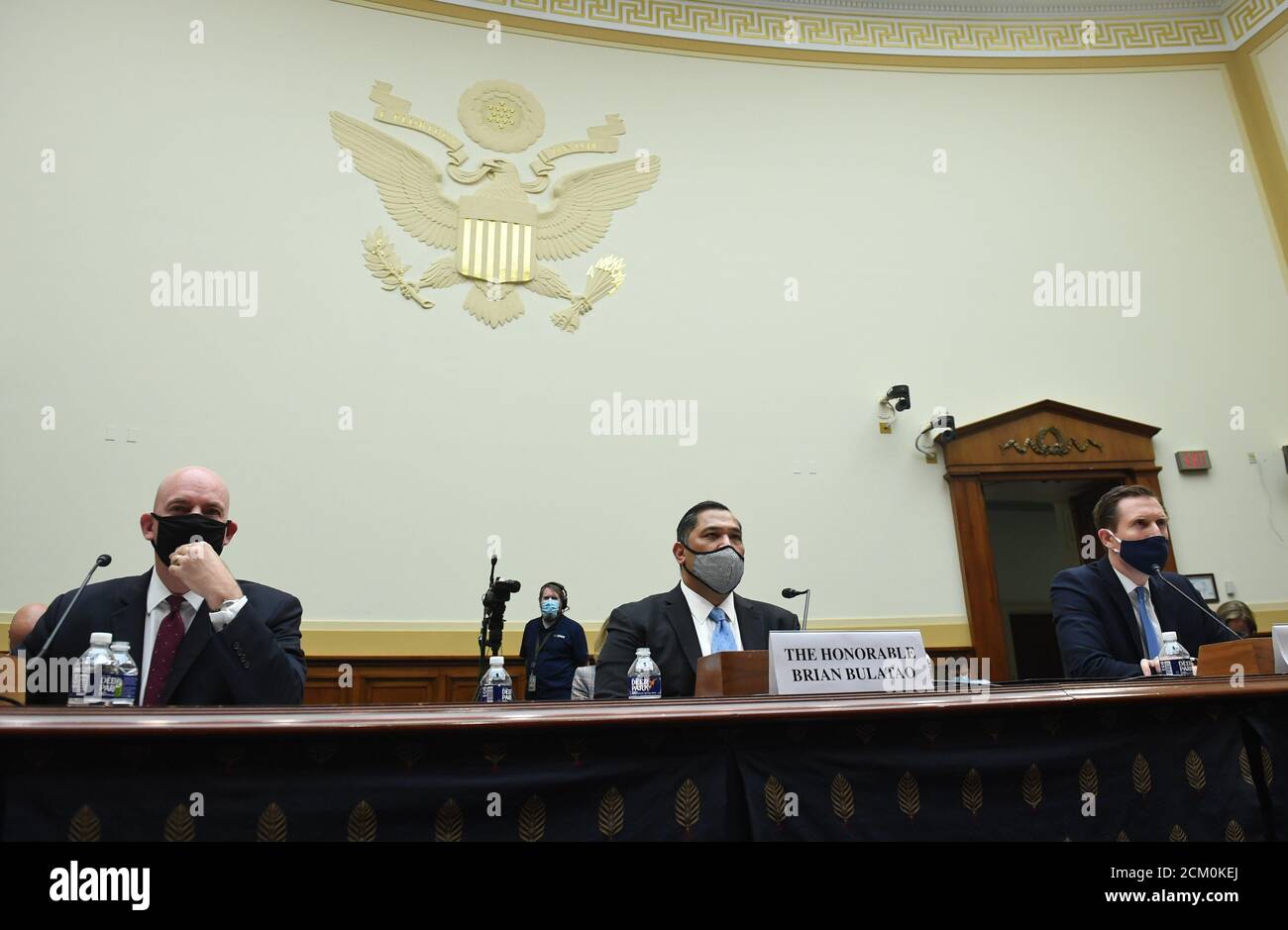 R. Clarke Cooper (L), Assistant Secretary of State for Political-Military Affairs, Brian Bulatao (C), Under Secretary of State for Management, and Marik String, Acting Legal Adviser for the State Department, testify before a House Committee on Foreign Affairs hearing looking into the firing of State Department Inspector General Steven Linick, on Capitol Hill in Washington, DC on Wednesday, September 16, 2020.Credit: Kevin Dietsch/Pool via CNP | usage worldwide Stock Photo