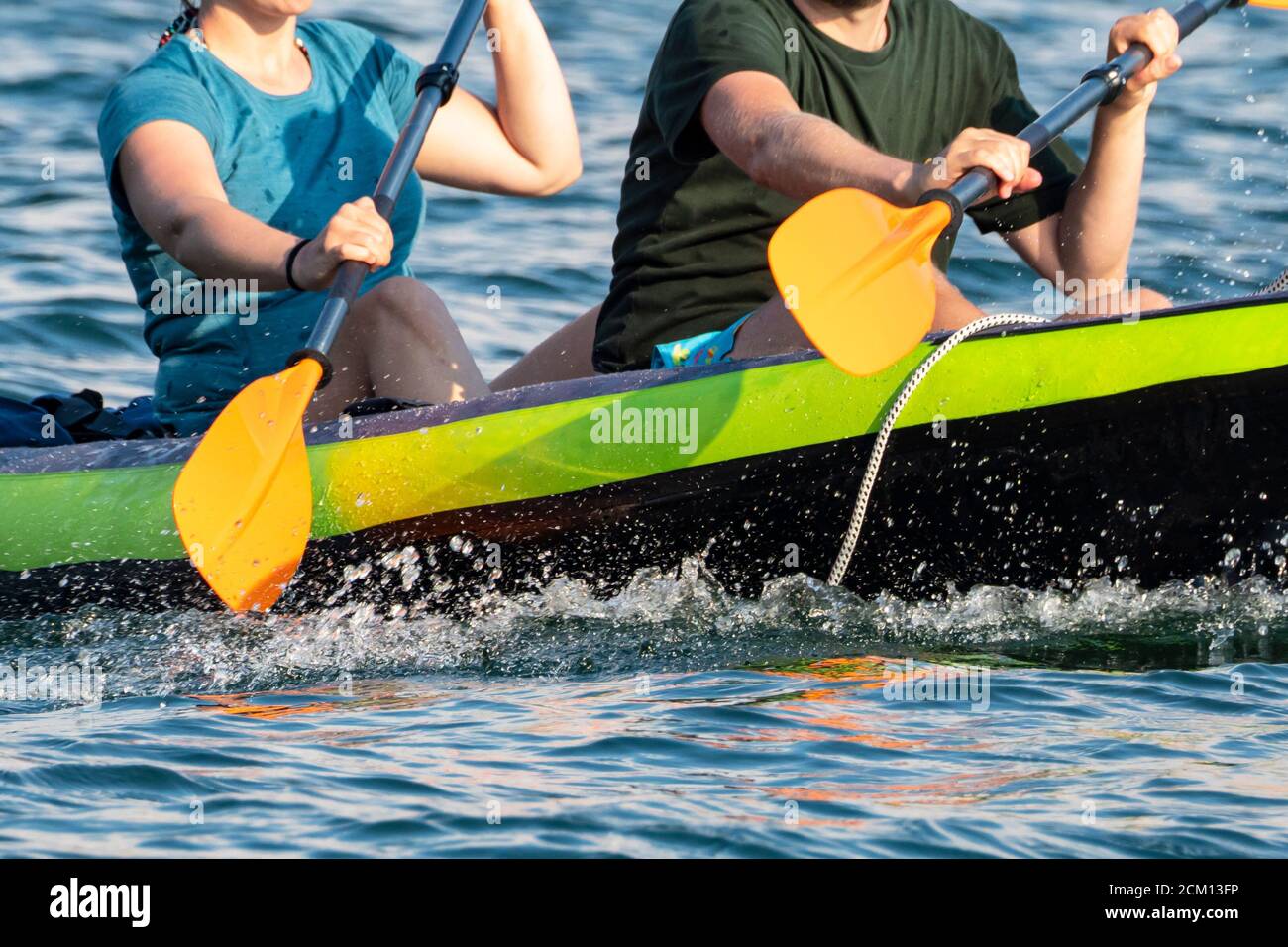 Canoeing scene on Lake Como Stock Photo Alamy
