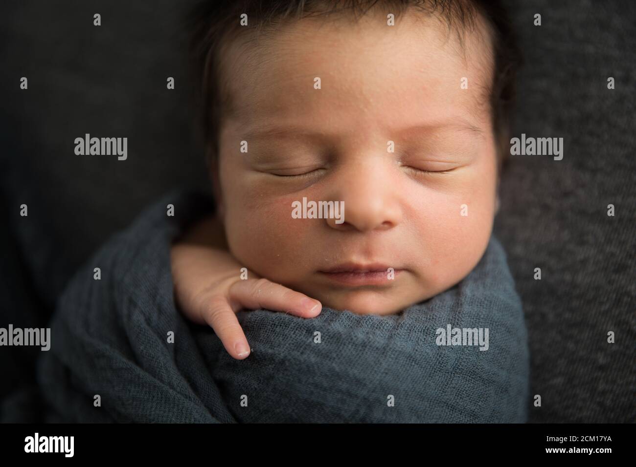 Close Up View of Sleeping Newborn Baby's Face, Lots of Hair Stock Photo