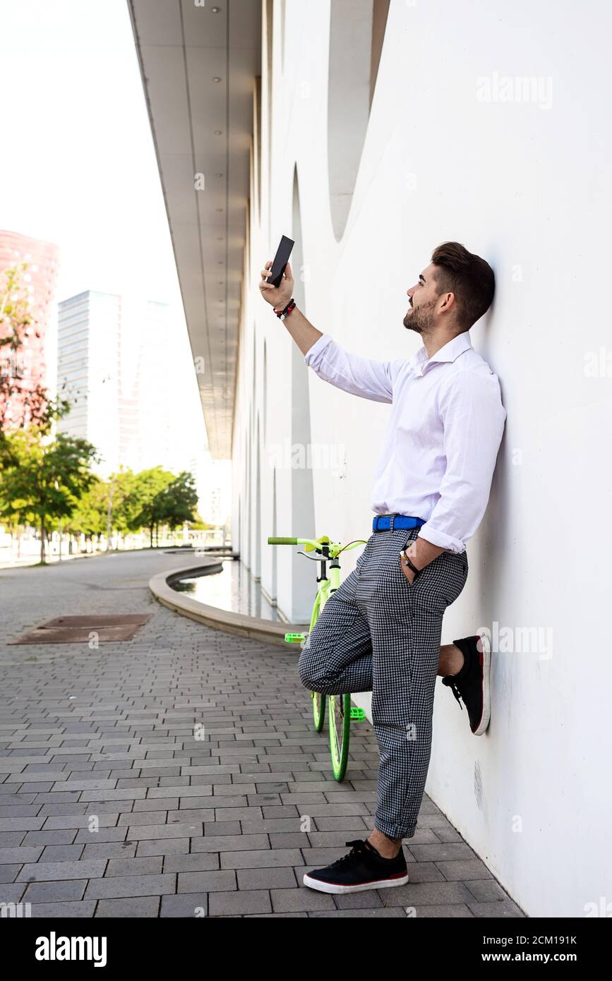 Portrait of stylish handsome young Young man taking selfies with phone Stock Photo