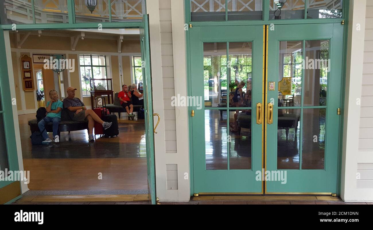 Double doors of the hotel foyer opened and closed at Disney's Port Orleans Resort  - Riverside, Orlando, Florida, United States Stock Photo