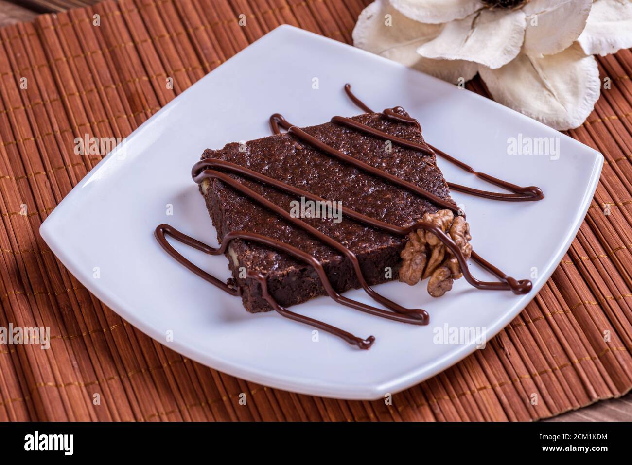 A slice of chocolate cake on table. Stock Photo