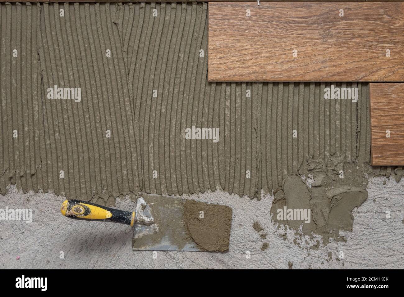 Ceramic tiles and tools for tiler. Floor tiles installation. Home