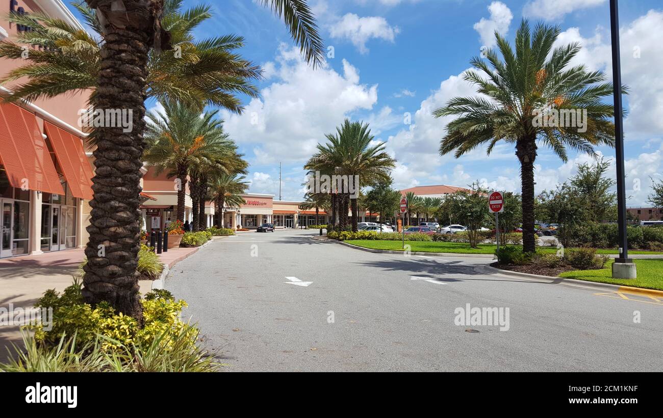 A shopping mall car park with palm trees on a sunny day in Orlando, Florida, United States Stock Photo
