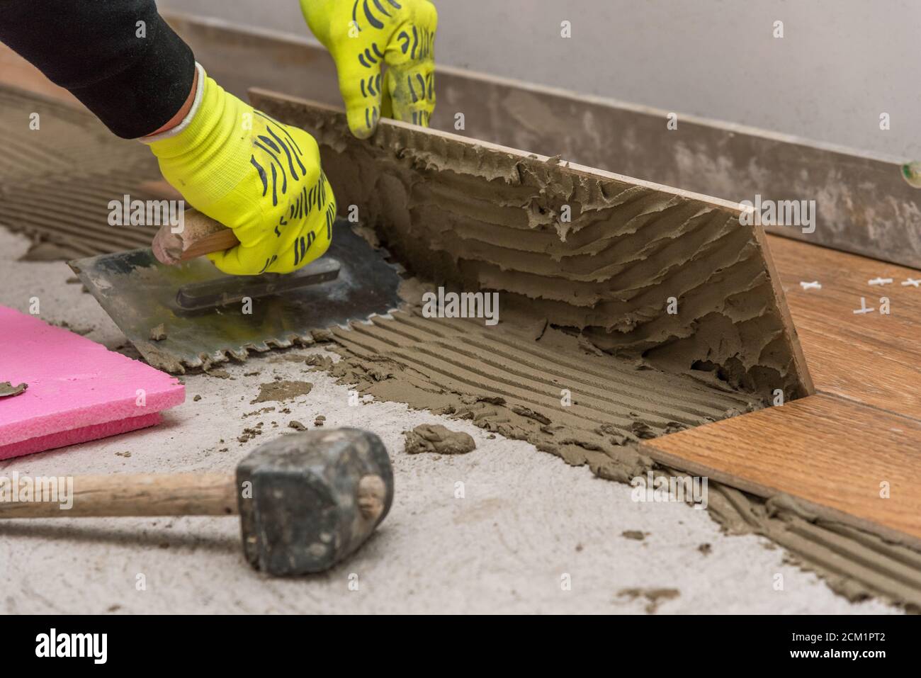 Ceramic tiles and tools for tiler. Floor tiles installation. Home