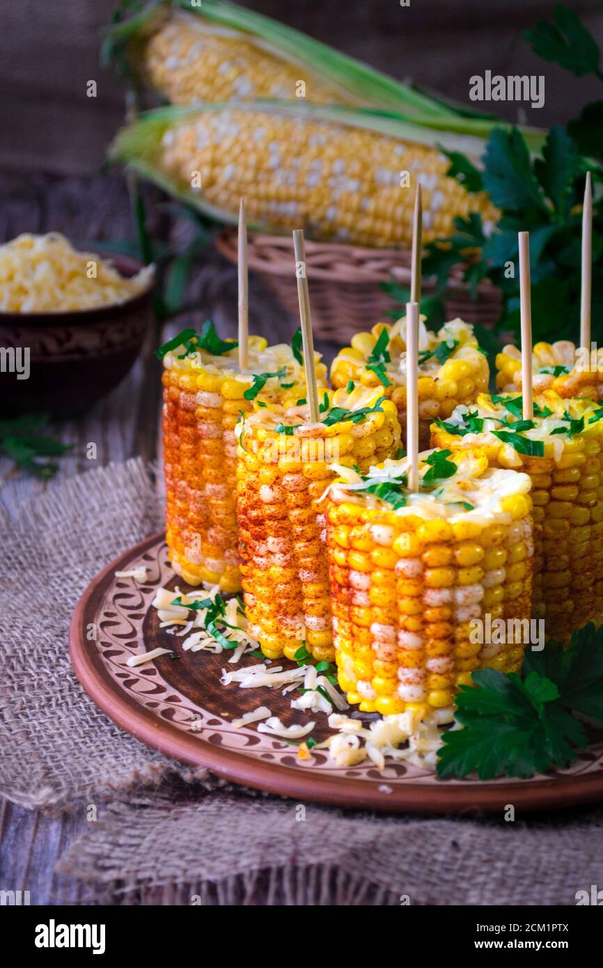 Boiled corn cobs with spices Stock Photo