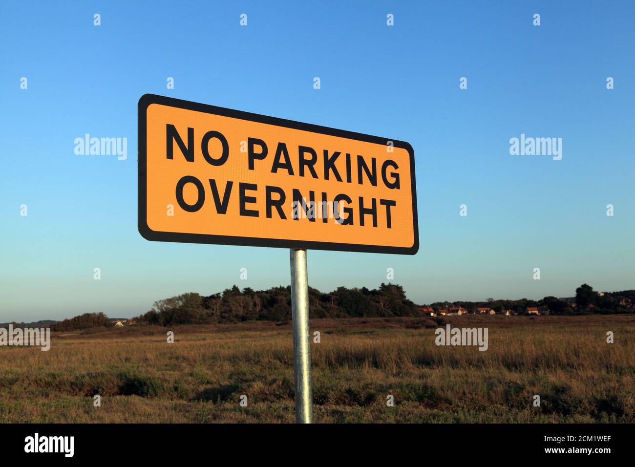NO PARKING OVERNIGHT, warning sign, Thornham Marsh and Harbour, Norfolk, England, UK. Stock Photo