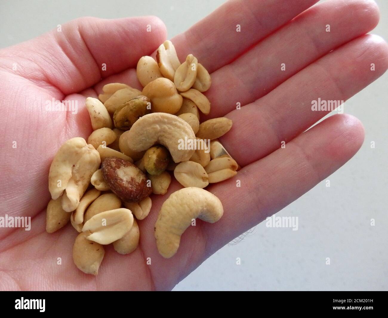 A handful of mixed nuts Stock Photo Alamy