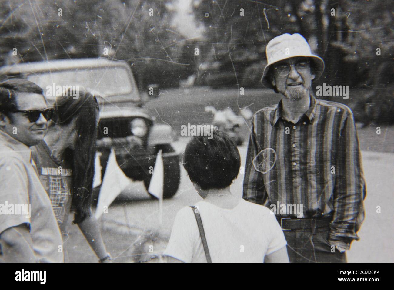 Fine 70s vintage black and white photography of neighbors hanging out at a suburban neighborhood block party. Stock Photo