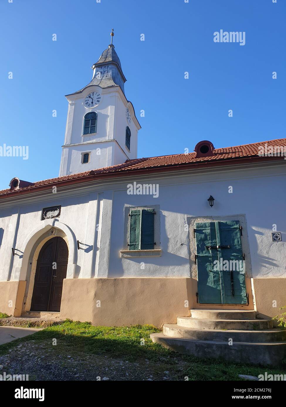 Closed metallic window shutters and gate in Rimetea, Romania. Architecture detail of unitarian church in the village of Rimetea, Torocko, Alba, Romani Stock Photo