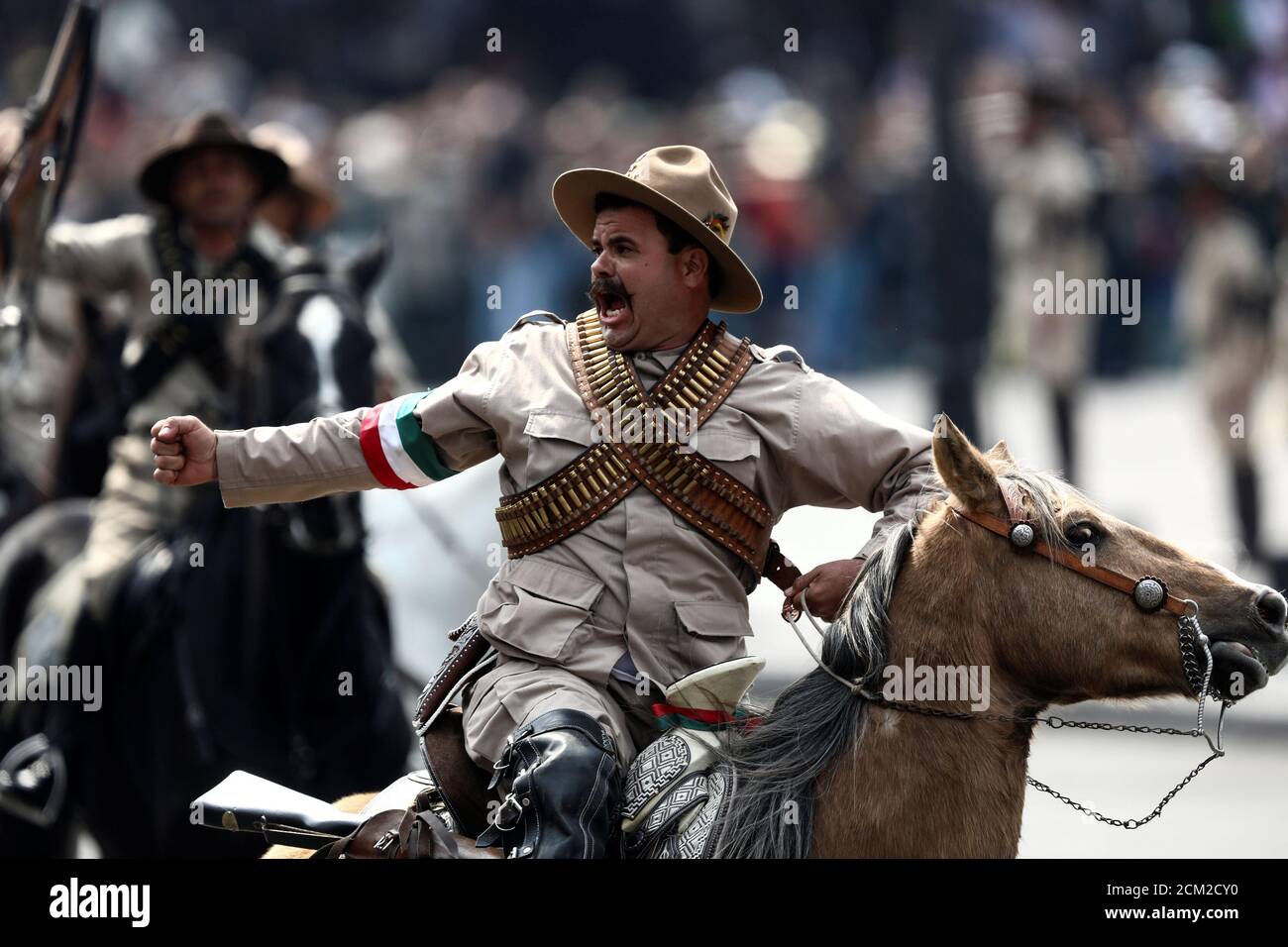 A participant wearing a period costume, takes part in a military parade
