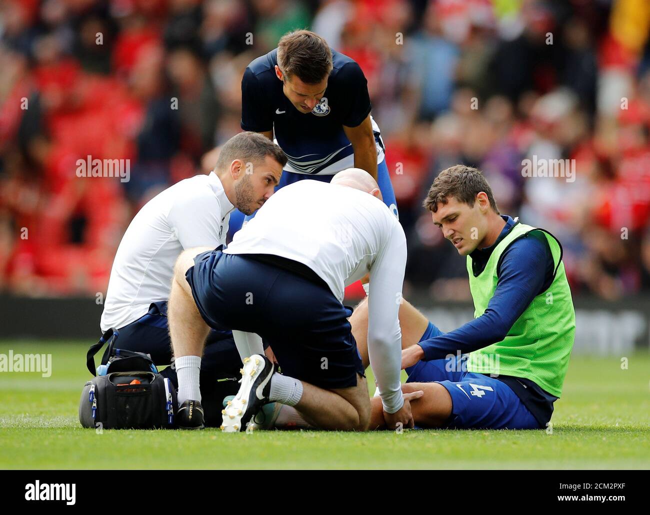 Soccer Football - Premier League - Manchester United v Chelsea - Old Trafford, Manchester, Britain - August 11, 2019  Chelsea's Andreas Christensen receives treatment after sustaining an injury during the warm up before the match  REUTERS/Phil Noble  EDITORIAL USE ONLY. No use with unauthorized audio, video, data, fixture lists, club/league logos or 'live' services. Online in-match use limited to 75 images, no video emulation. No use in betting, games or single club/league/player publications.  Please contact your account representative for further details. Stock Photo