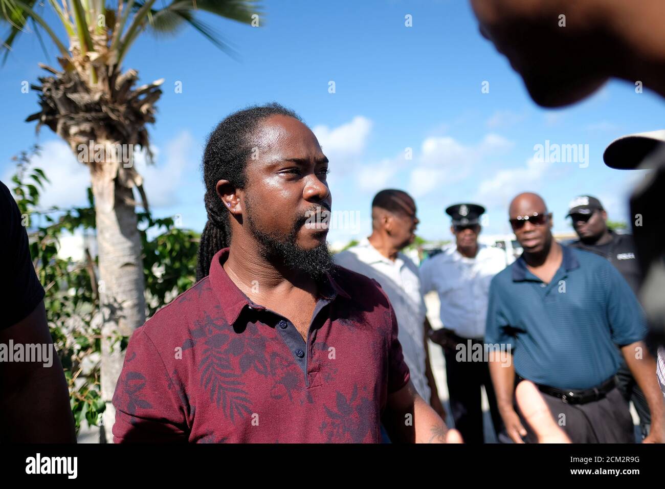 REFILE - CORRECTING TYPO  Marshall Mitchel, the half-brother of victim Kenny Mitchel, speaks to the press after the hearing of Gavin 'Scott' Hapgood, a UBS financial advisor, who is accused of killing a hotel worker while on vacation in April 2019, in The Valley, Anguilla August 22, 2019. REUTERS/Ricardo Arduengo Stock Photo
