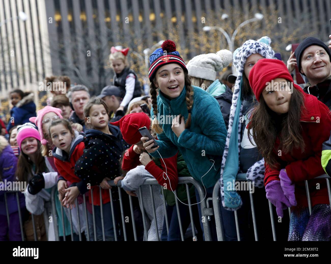 People watch floats make their way down 6th avenue during the 89th Macy's Thanksgiving Day Parade in the Manhattan borough of New York, November 26, 2015. REUTERS/Shannon Stapleton Stock Photo