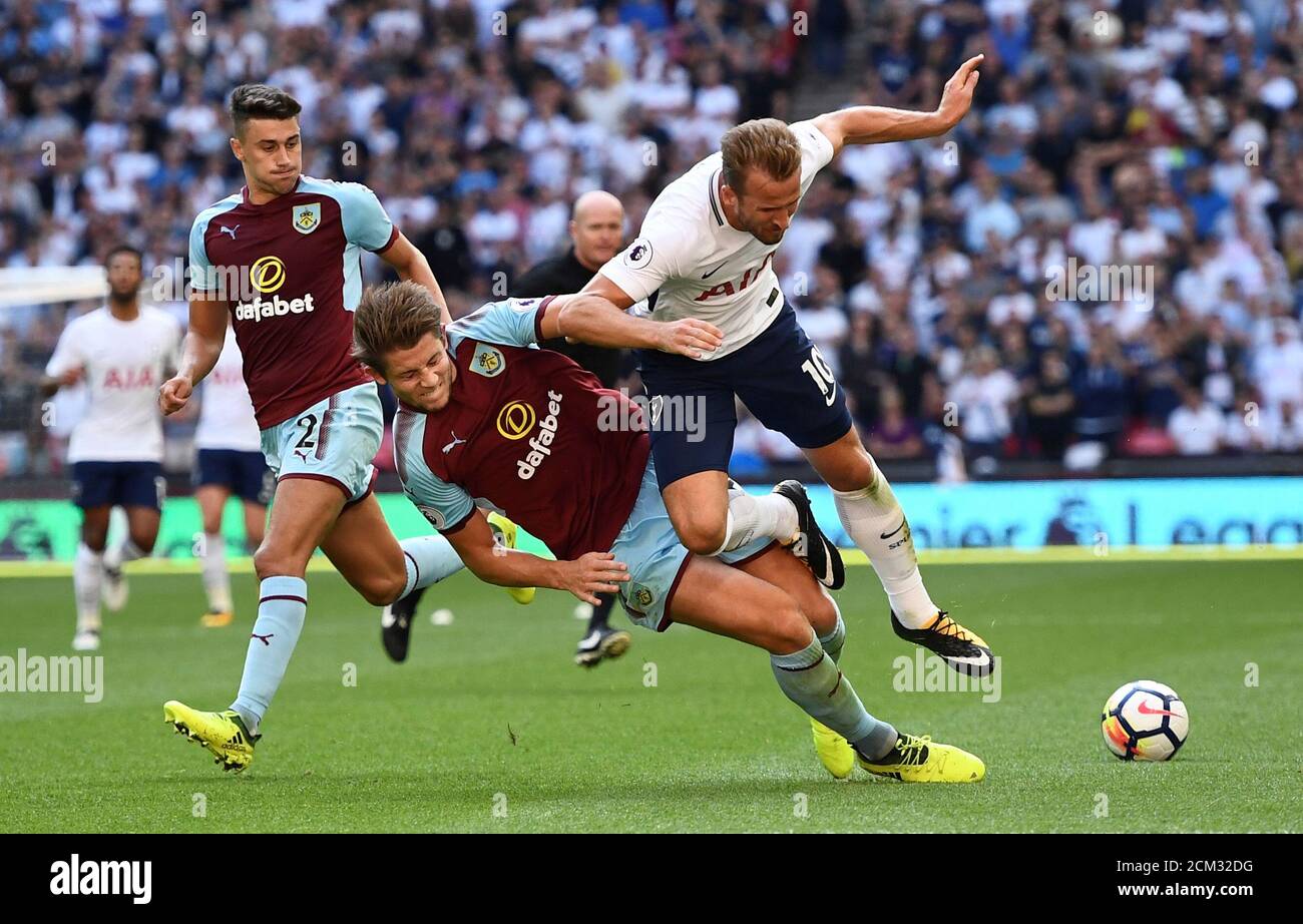 Soccer Football - Premier League - Tottenham Hotspur vs Burnley - London, Britain - August 27, 2017   Tottenham's Harry Kane in action with Burnley's James Tarkowski    REUTERS/Dylan Martinez    EDITORIAL USE ONLY. No use with unauthorized audio, video, data, fixture lists, club/league logos or 'live' services. Online in-match use limited to 45 images, no video emulation. No use in betting, games or single club/league/player publications. Please contact your account representative for further details. Stock Photo