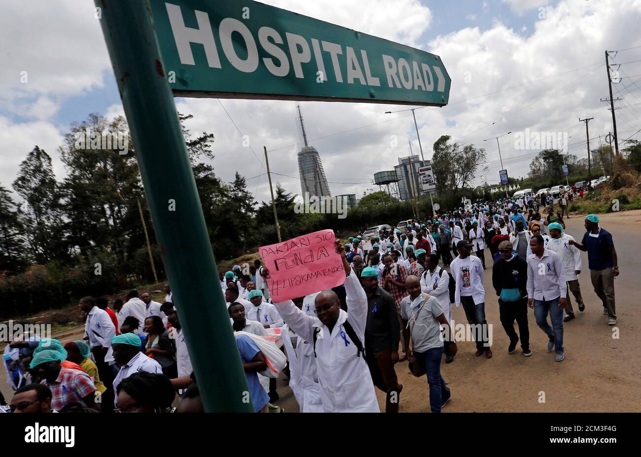 Kenyan doctors march during a strike to demand fulfilment of a 2013 agreement between their union and the government that would raise their pay and improve working conditions in Nairobi, Kenya December 5, 2016. REUTERS/Thomas Mukoya Stock Photo