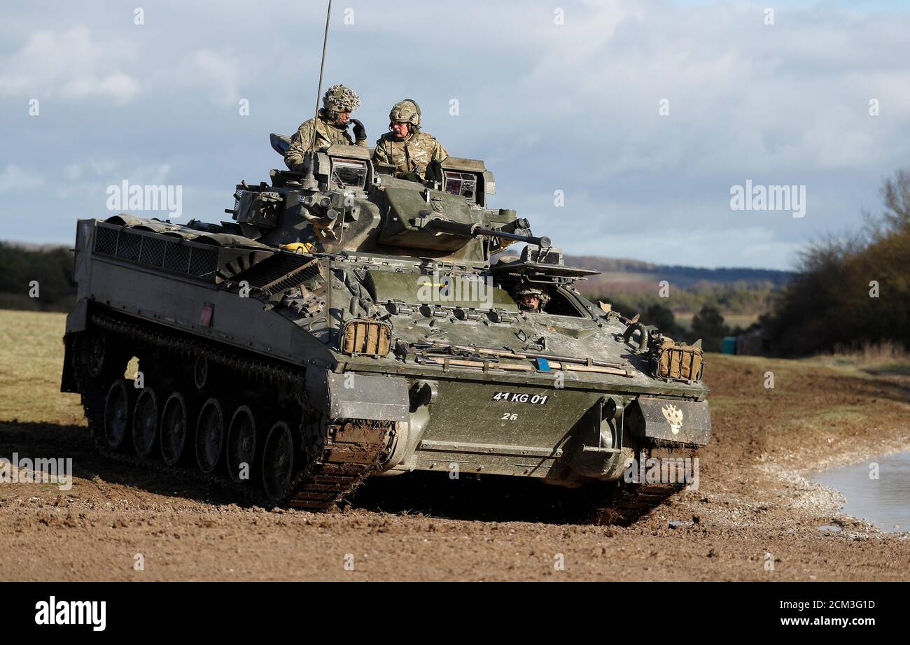 Britain's Prince Charles takes a ride on a Warrior Tracked Armoured Vehicle  during a training exercise on a visit to The Mercian Regiment at their  barracks in Bulford, Wiltshire, Britain, February 9,