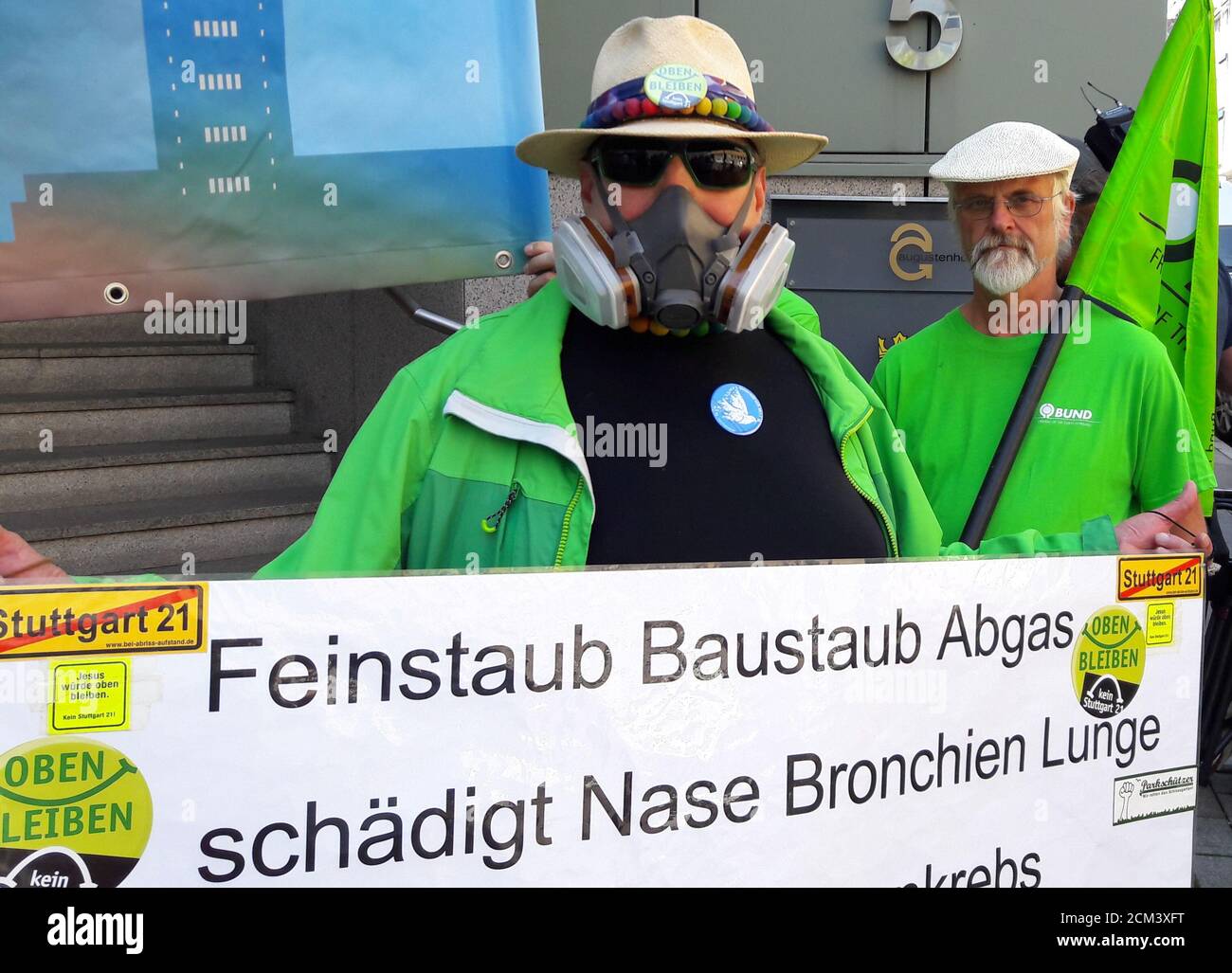 Protesters demonstrate against pollution in front of a court in Stuttgart, Germany, July 19, 2017. Placard reads 'Particular matter pollution, builders dust, exhaust harm nose, bronchia, lung'. REUTERS/Ilona Wissenbach Stock Photo