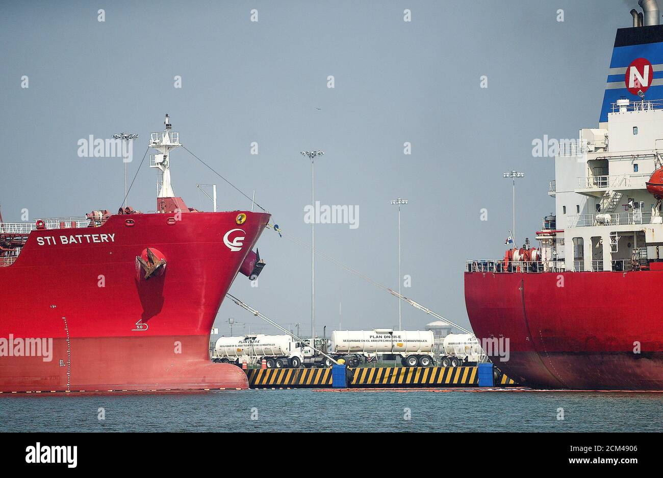 Tanker trucks are seen among oil tankers docked at the port of Tuxpan, in Veracruz state, Mexico April 22, 2020. Picture taken April 22, 2020. REUTERS/Oscar Martinez Stock Photo