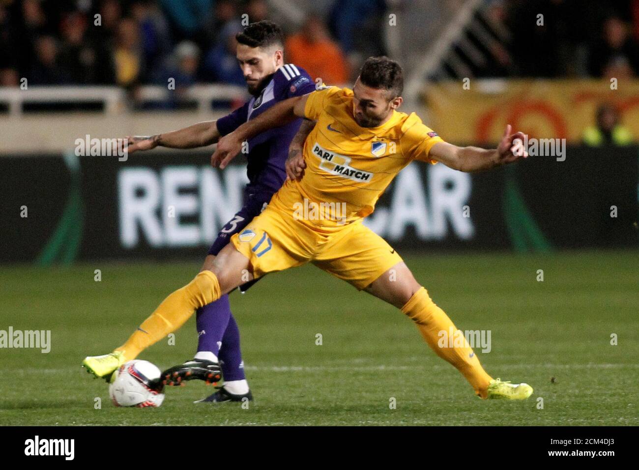 Football Soccer - Europa League - Apoel FC vs Anderlecht - Round of 16 First Leg - Gsp stadium, Nicosia, Cyprus - 09/03/2017. David Barral  of Apoel FC and Nicolae Stanciu of Anderlecht in action. REUTERS/Yiannis Kourtoglou Stock Photo