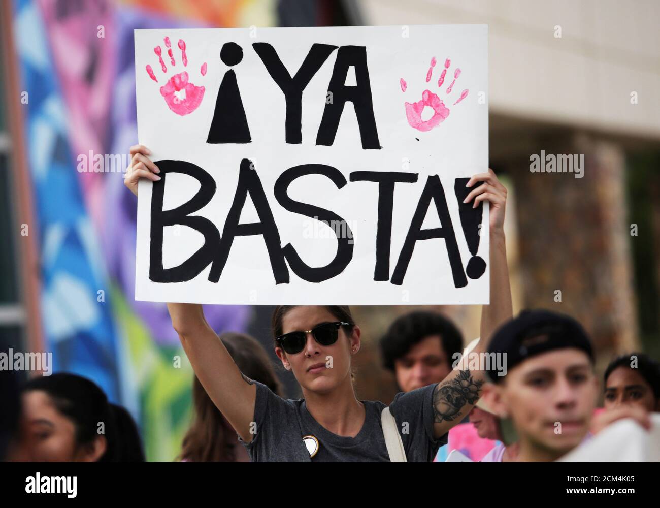 A protester holds a sign during an immigration rights rally at Cleveland Square Park in El Paso, Texas, U.S. July 12, 2019. The sign reads 'It's enough'. REUTERS/Daniel Becerril Stock Photo