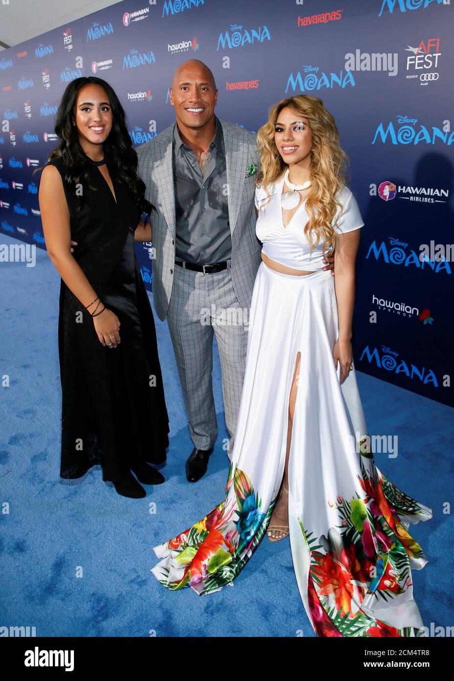 Actor Dwayne Johnson C Poses With His Daughter Simone Alexandra Johnson L And Singer Dinah Jane Hansen R At The World Premiere Of Walt Disney Animation Studios Moana As A Part Of Afi Actor Dwayne Johnson C Poses With His Daughter Simone Alexandra Johnson L And Singer Dinah Jane Hansen R At The World Premiere Of Walt Disney Animation Studios Moana As A Part Of Afi