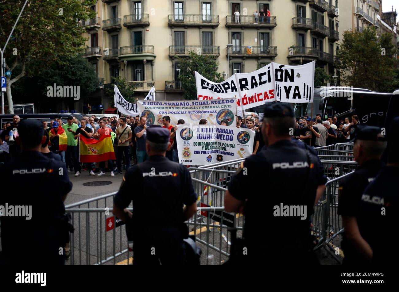Spanish National Police officers stand guard during a protest of Spanish National Police and Civil Guards for equal salaries with autonomous police forces outside the Spanish government delegation offices in Barcelona, Spain September 28, 2017. REUTERS/Jon Nazca Stock Photo