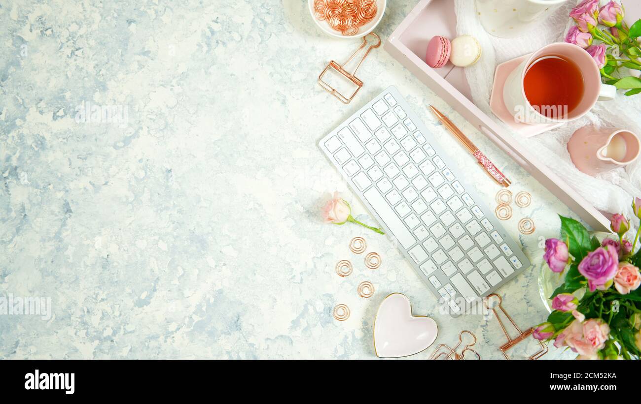 Blush pink theme cosy hygge desktop workspace with keyboard smart phone ...