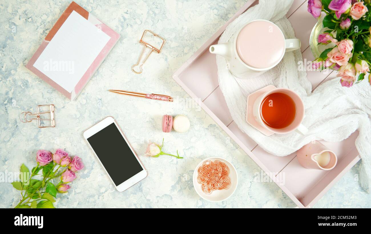 Blush pink theme cosy hygge desktop workspace with keyboard smart phone ...