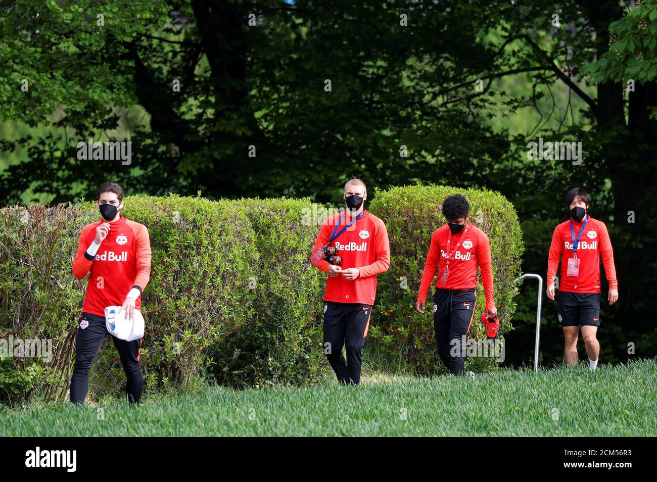 Soccer Football - Red Bull Salzburg Training - Red Bull Trainingszentrum, Salzburg, Austria - April 21, 2020 Red Bull Salzburg players arrive for training wearing protective face masks despite most sport being cancelled around the world as the spread of coronavirus disease (COVID19) continues. REUTERS/Leonhard Foeger Stock Photo