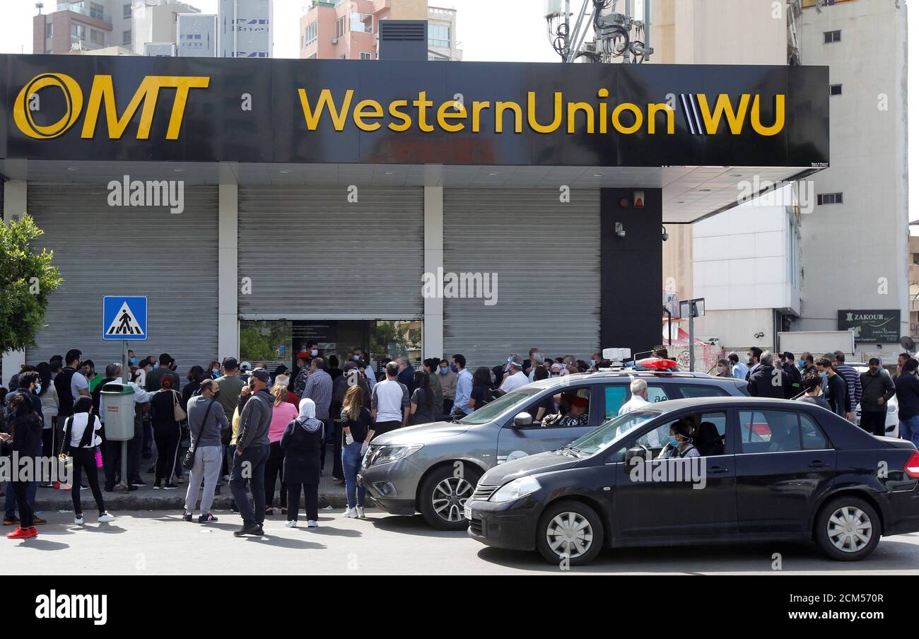 Crowds are formed outside the money transfer offices of Western Union and  OMT after customers were informed it was the last day to retrieve transfers  in dollars, in Beirut, Lebanon April 23,