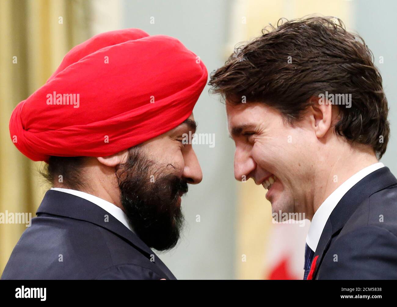 Canada's new Innovation, Science and Economic Development Minister Navdeep Bains (L) is congratulated by Prime Minister Justin Trudeau at Rideau Hall in Ottawa November 4, 2015. Morneau's expertise on pension reform will likely also be a significant asset to the newly sworn in Liberal Prime Minister Justin Trudeau, who promised during the election campaign to work with the provinces and businesses to enhance the national pension plan.   REUTERS/Chris Wattie Stock Photo