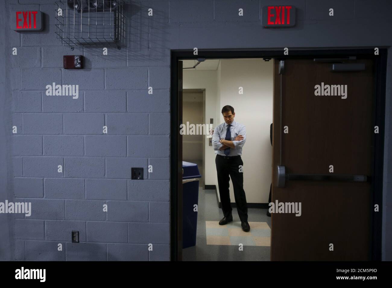 U.S. Senator and Republican presidential candidate Marco Rubio listens to the invocation from a backstage area before a campaign rally at Palm Beach Atlantic University in West Palm Beach, Florida, March 14, 2016.  REUTERS/Carlo Allegri      TPX IMAGES OF THE DAY Stock Photo