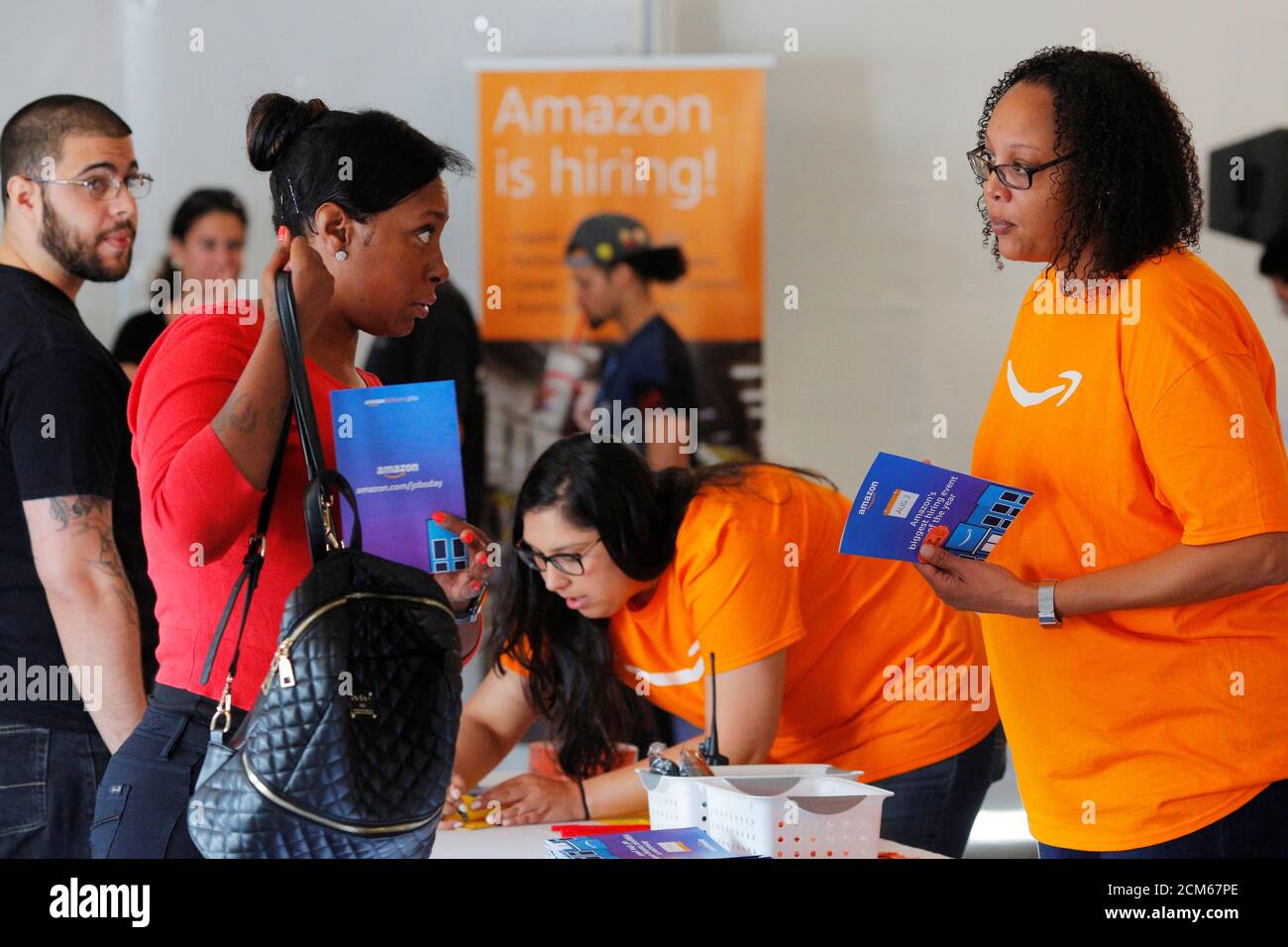 Potential job applicants register for "Amazon Jobs Day," a job Potential job applicants register for "Amazon Jobs Day," a job