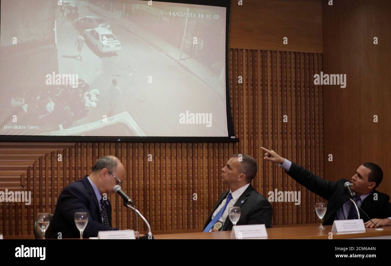 Police chief officer Giniton Lages gestures next to Civil Police secretary Marcio Vinicius Braga and governor Wilson Witzel during a news conference after two former police officers were arrested and charged in connection with the murder of activist and councilwoman Marielle Franco, Rio de Janeiro, Brazil March 12, 2019. REUTERS/Sergio Moraes Stock Photo