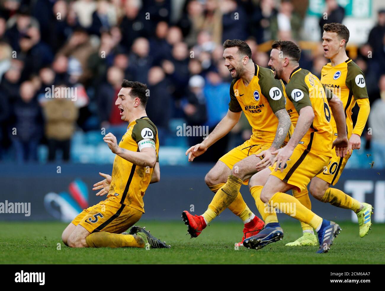 Soccer Football -  FA Cup Quarter Final - Millwall v Brighton & Hove Albion  - The Den, London, Britain - March 17, 2019  Brighton's Lewis Dunk celebrates after the match with team mates   Action Images via Reuters/Paul Childs Stock Photo