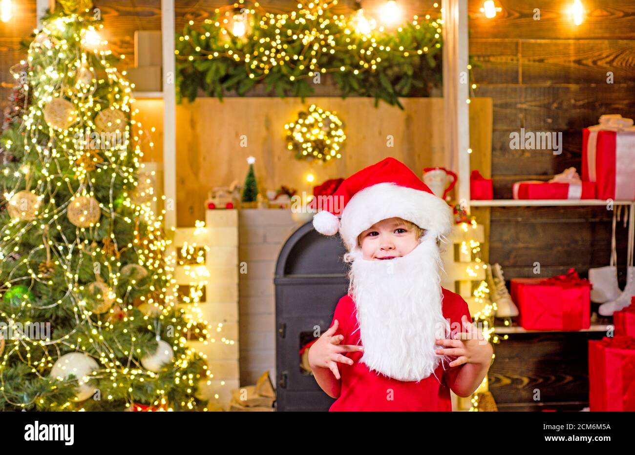 Birkdale Christmas Tree Lighting 2022 Kid Having Fun Near Christmas Tree Indoors. Happy Child With White Beard.  Christmas Celebration Holiday. Happy Little Child Dressed In Winter  Clothing Stock Photo - Alamy