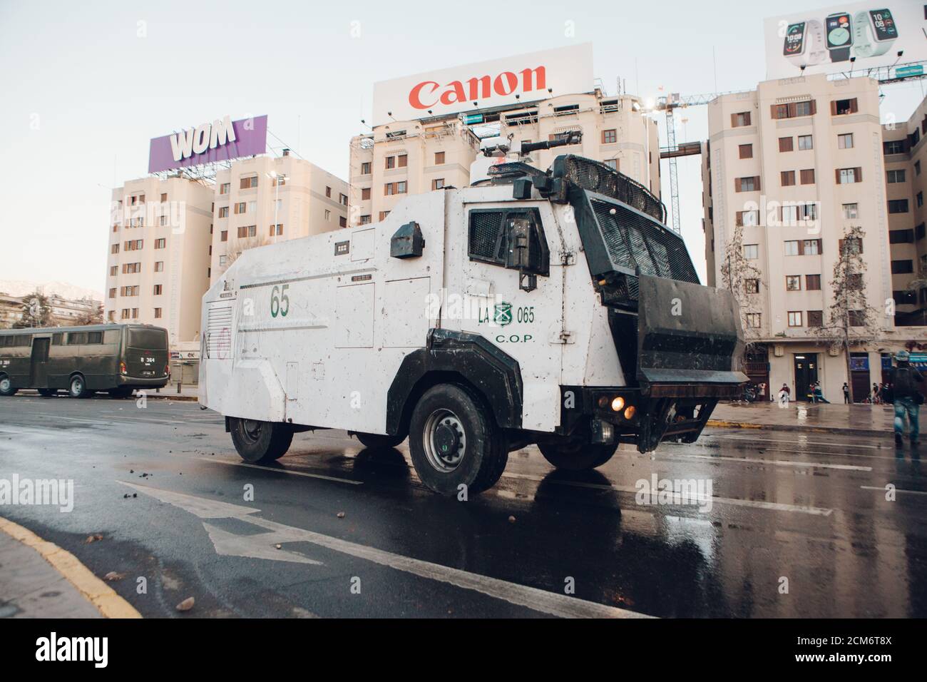 SANTIAGO, CHILE - SEPTEMBER 11, 2020 - A police water cannon disperses protesters against Sebastian Pinera's government. Hundreds of people came to th Stock Photo